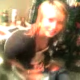 A low-resolution video clip of a blonde girl on the toilet.